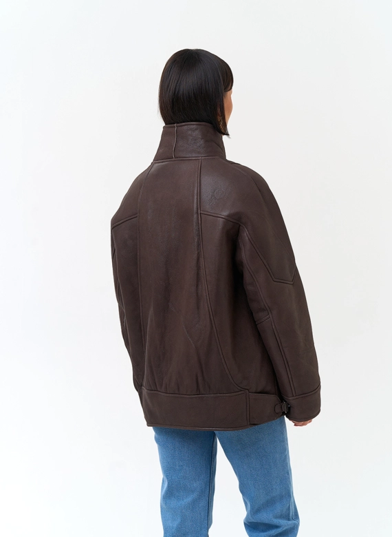 Женская дубленка из натурального меха с воротником стойкой фото